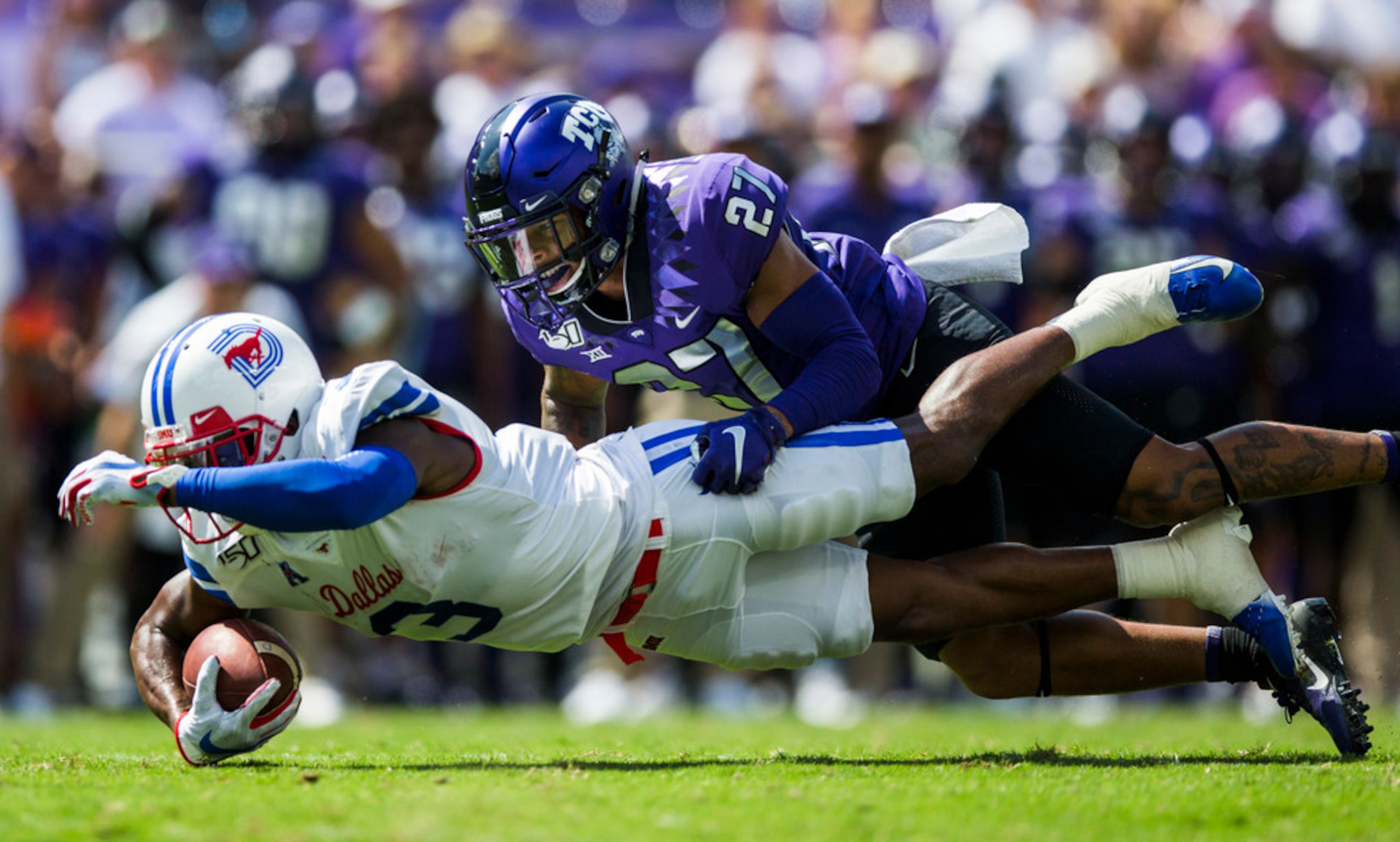 Southern Methodist Mustangs wide receiver James Proche (3) dives for extra yardage while...