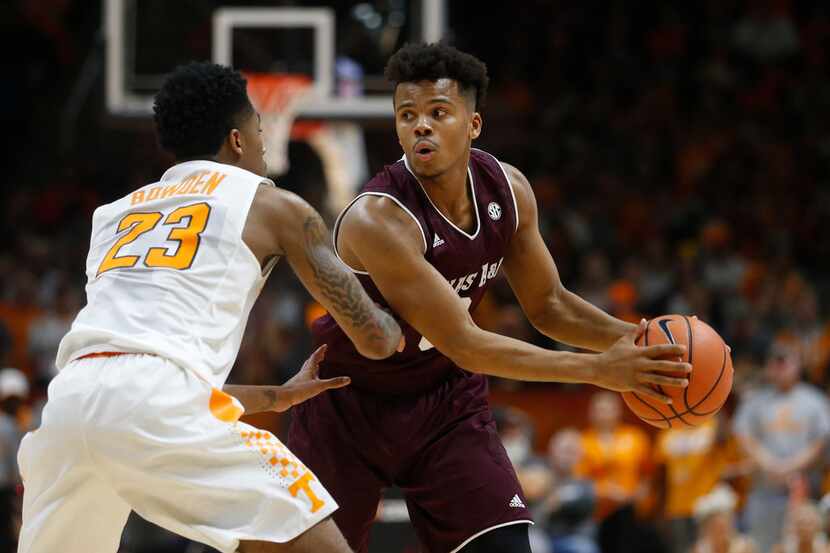 Texas A&M guard Admon Gilder (3) is defended by Tennessee guard Jordan Bowden (23) during...