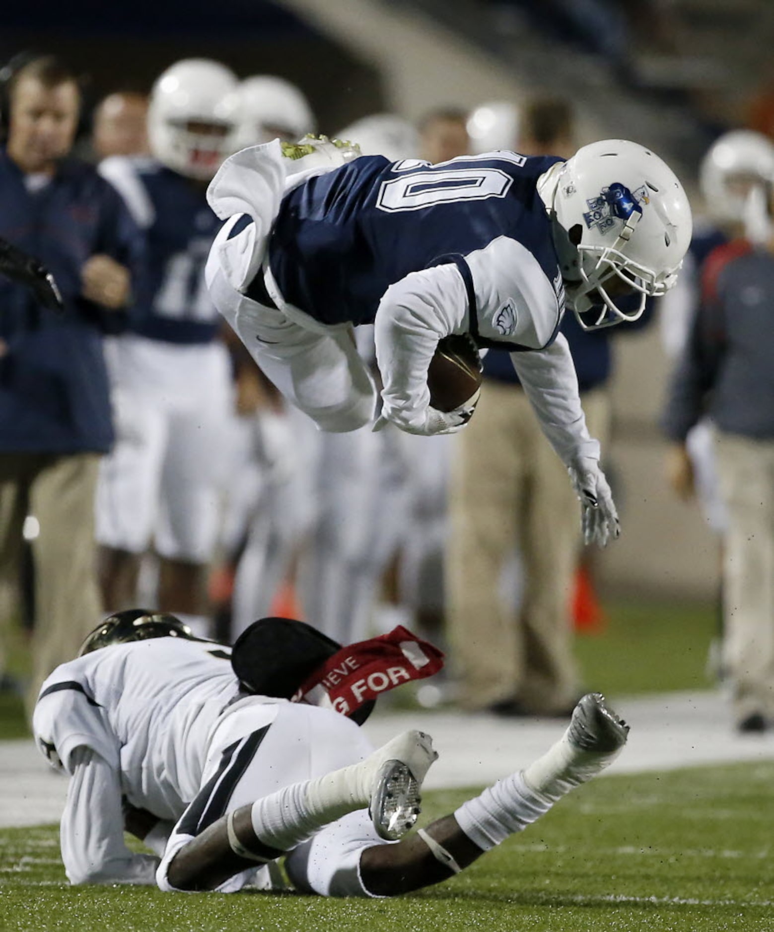 Allen's Jared Tajalle (10) is tackled by Plano East's Jordan Williams (9) after a catch...