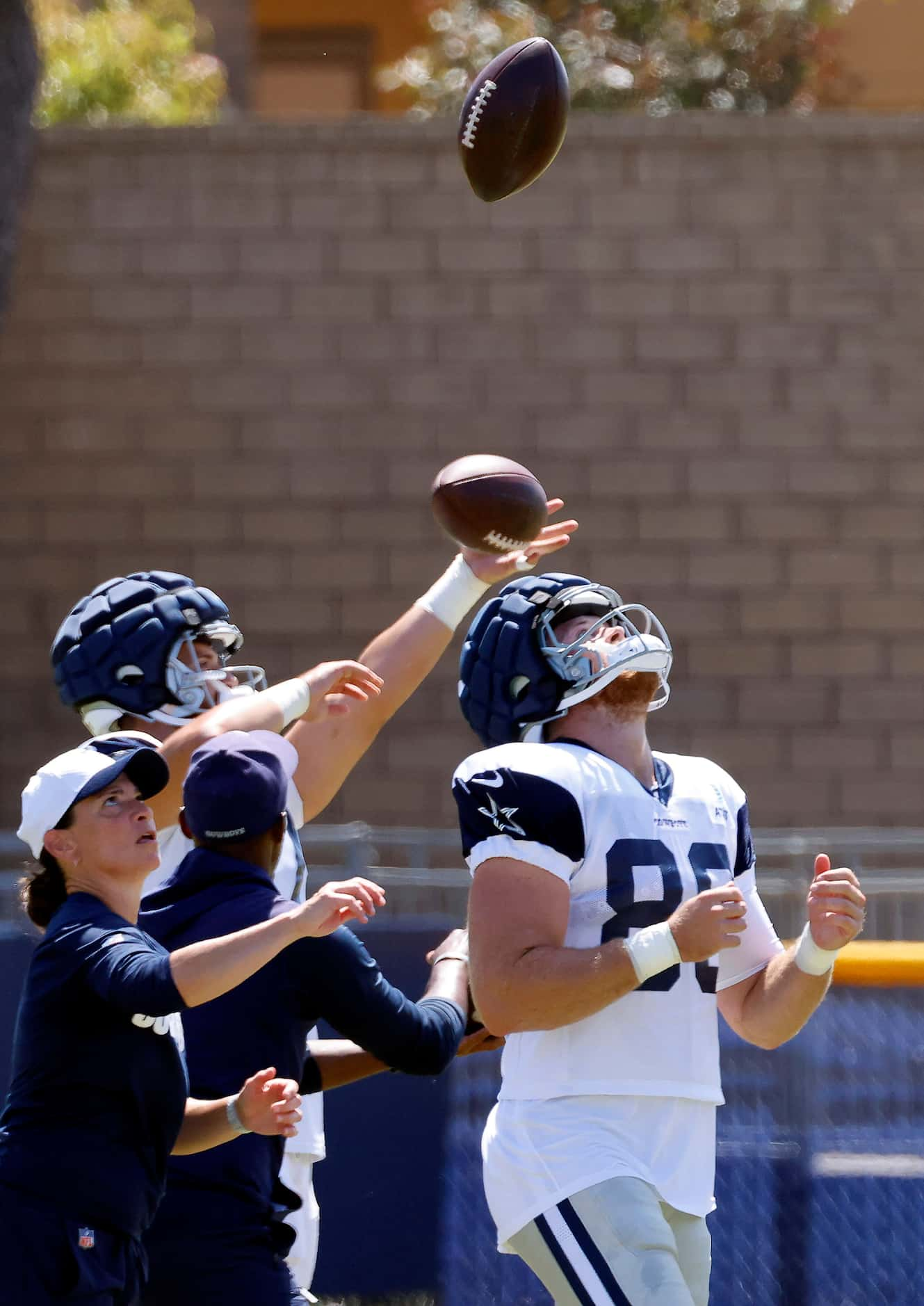 Dallas Cowboys tight end Luke Schoonmaker (86) catches football thrown over his head, as to...