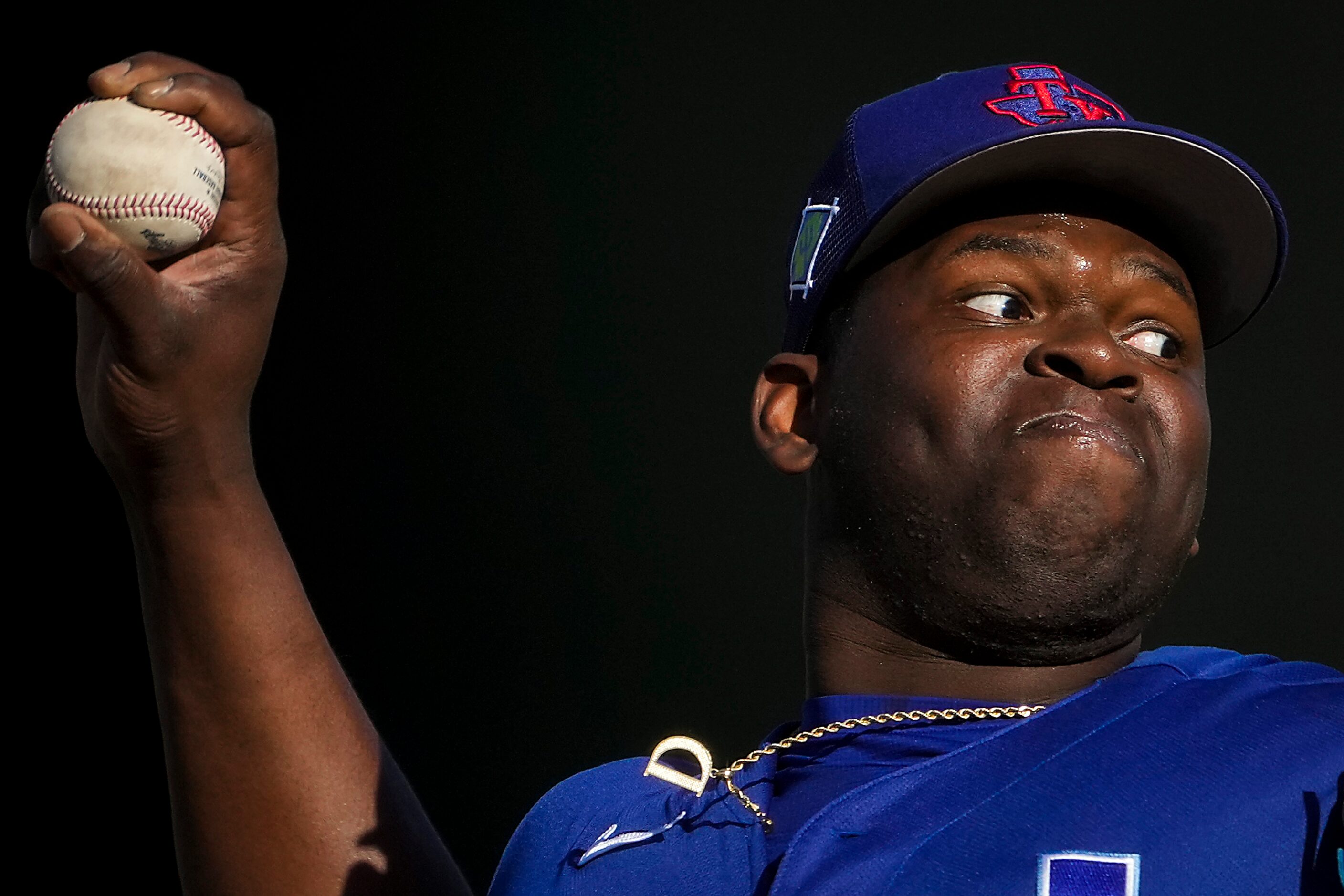 Texas Rangers pitcher Demarcus Evans delivers during the seventh inning of a spring training...