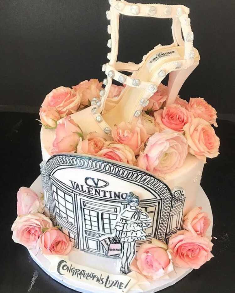 A Valentino cake with fresh flowers and hand painting by Samantha Cade.