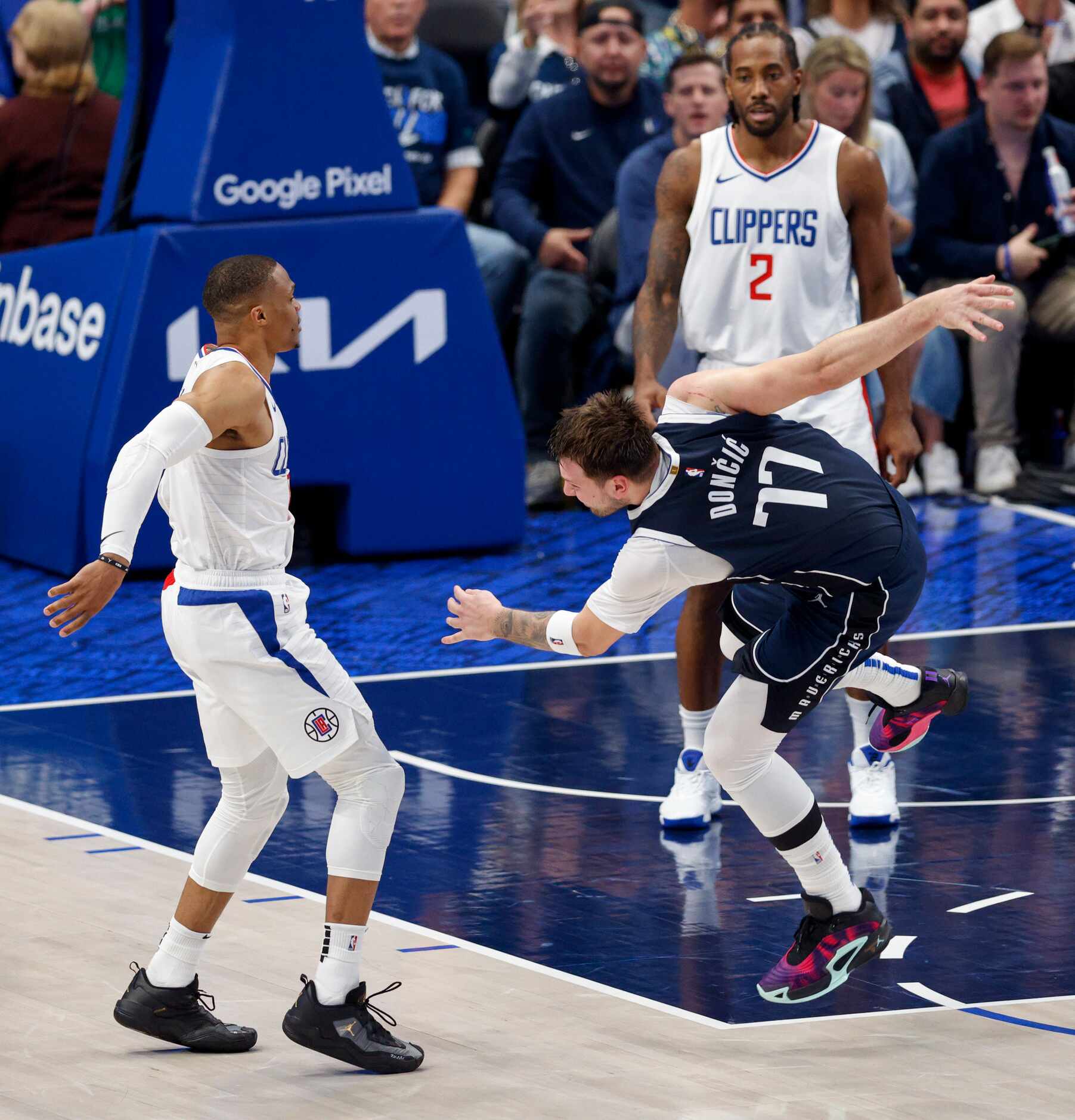 Dallas Mavericks guard Luka Doncic (77) reacts after being fouled by LA Clippers guard...