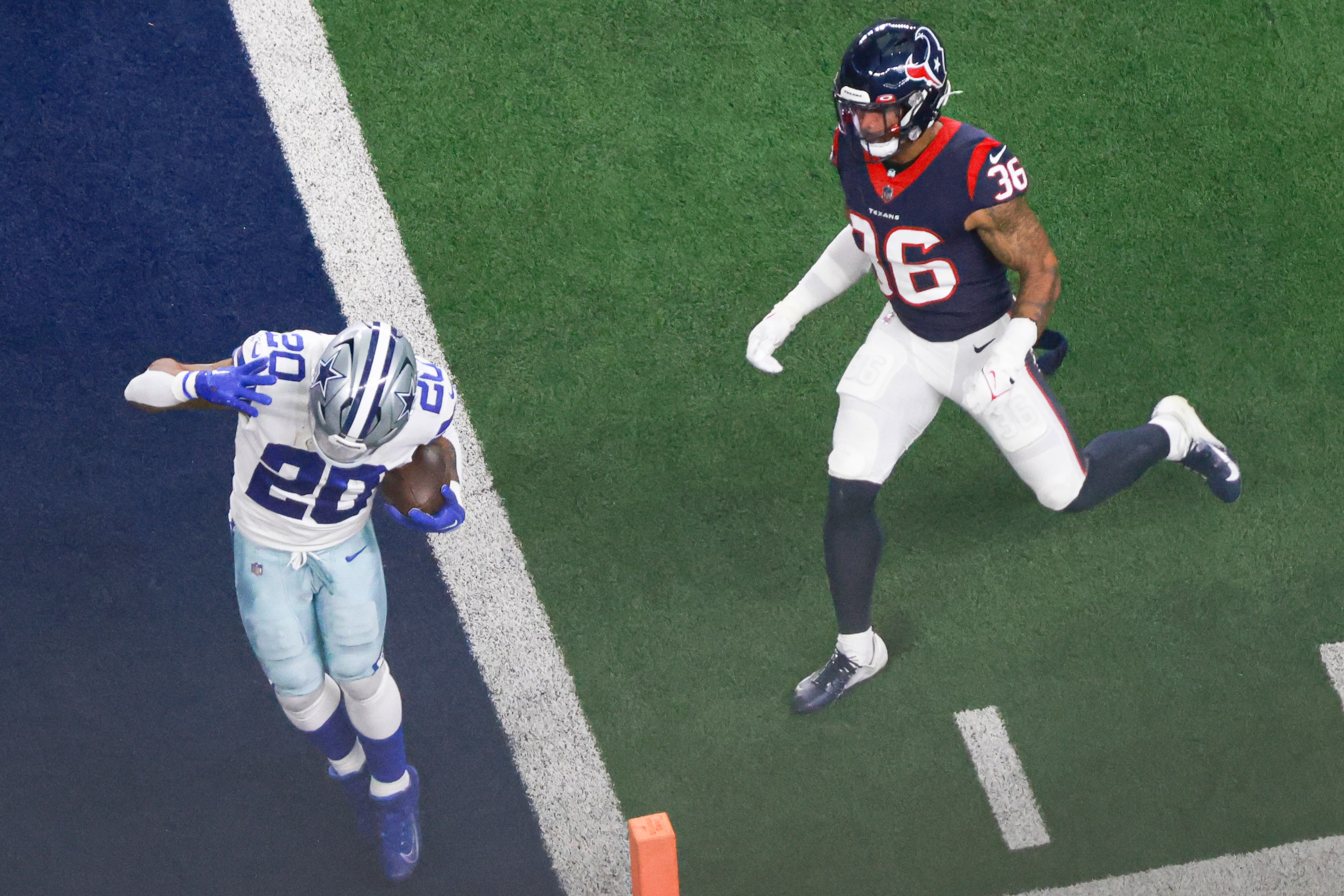 Dallas Cowboys running back Tony Pollard (20) runs into the end zone scoring a touchdown in...