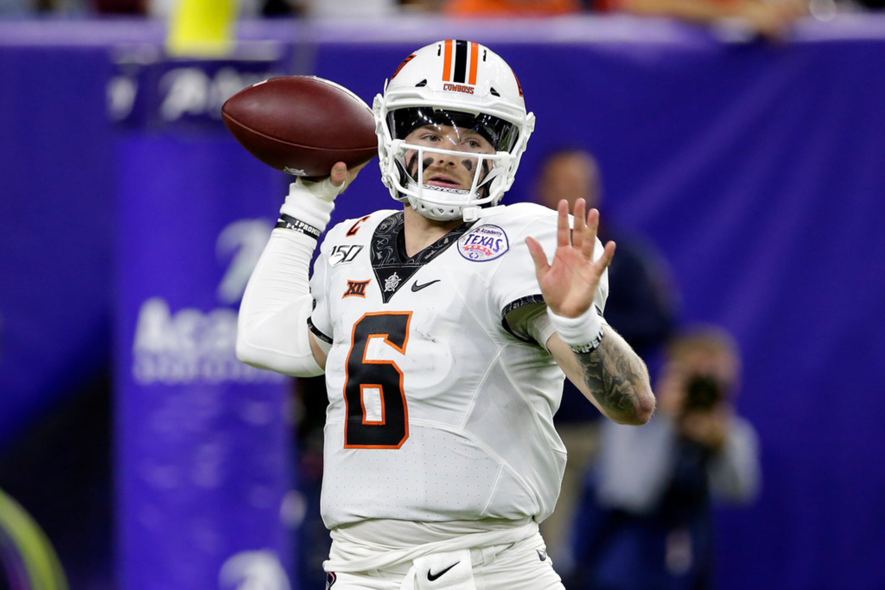 Oklahoma State quarterback Dru Brown looks to pass the ball against Texas A&M during the...