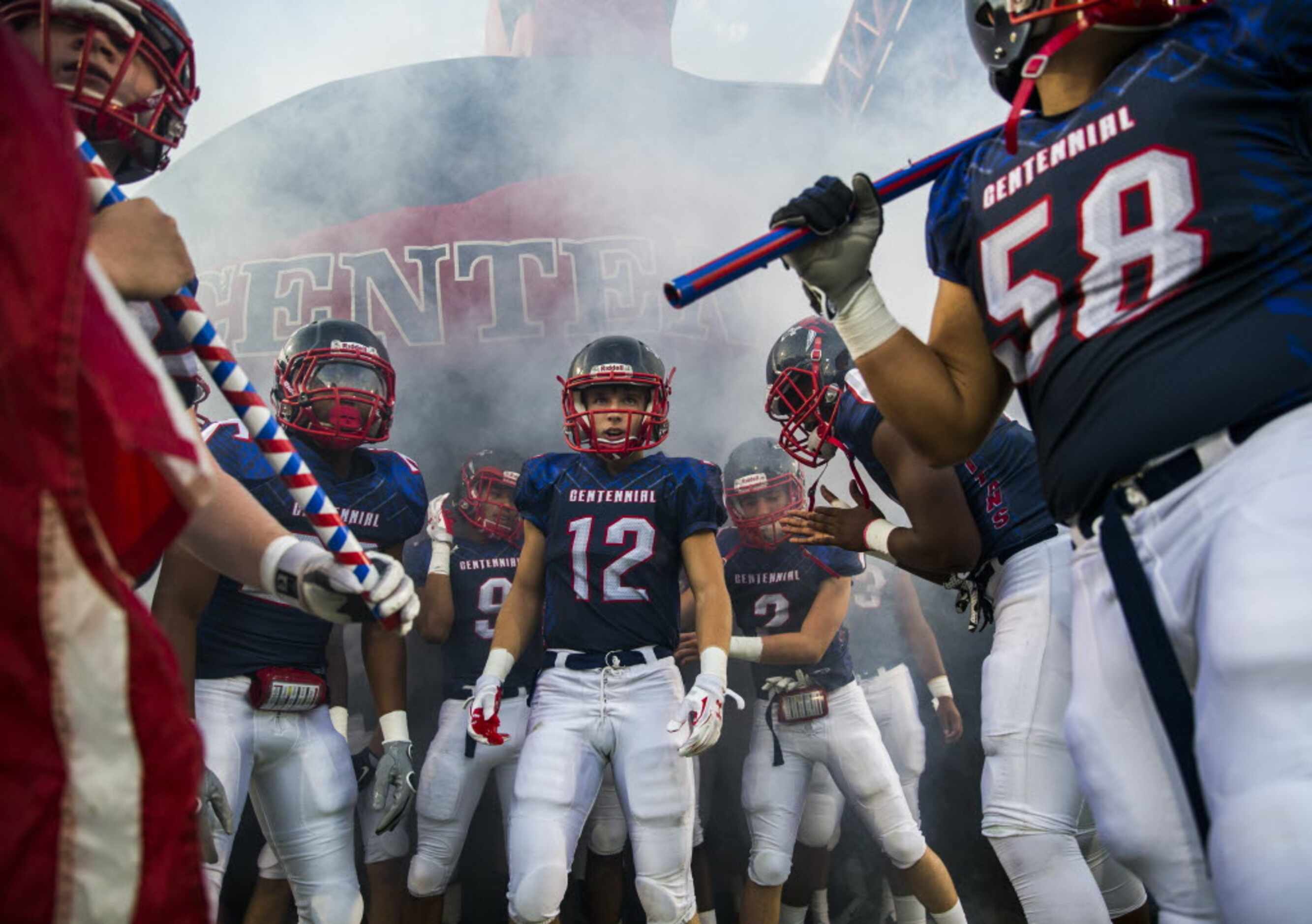 Frisco Centennial football players prepare to take the field against Frisco on Friday,...