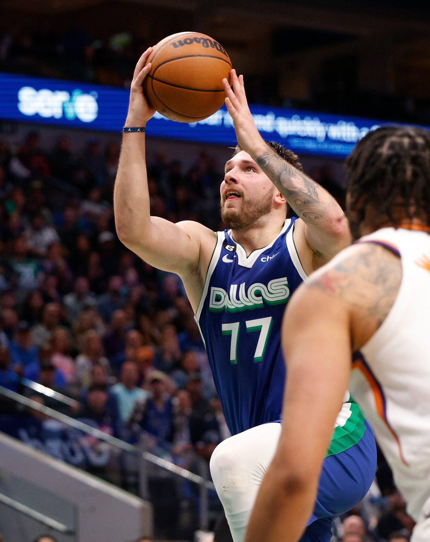 Dallas Mavericks guard Luka Doncic (77) attempts a layup during the second half of an NBA...