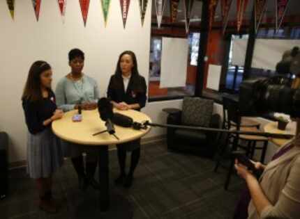  LaChelle Cunningham (center), dean of college prep at Uplift Hampton Preparatory, discussed...