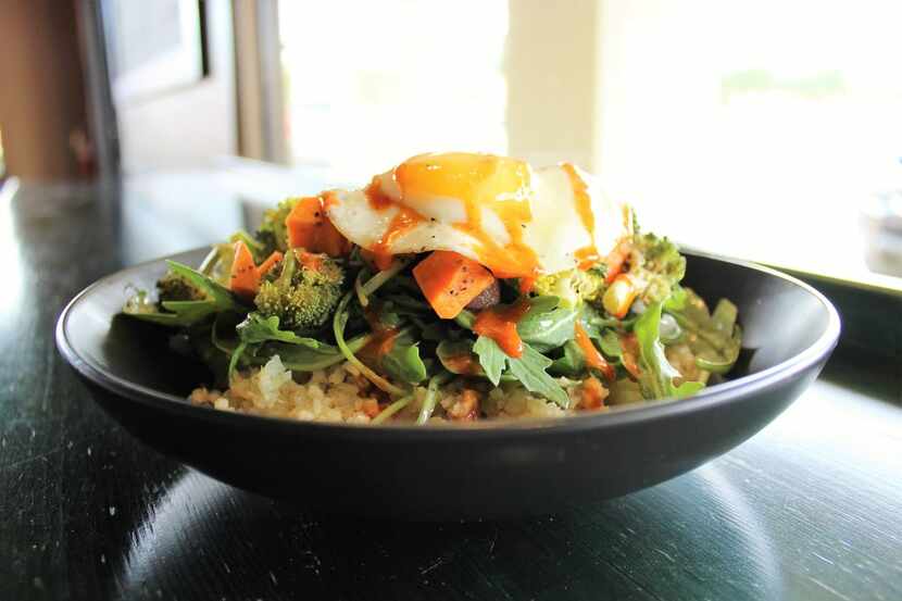Warm Riced Cauliflower Breakfast Salad with an egg on top at Snappy Salads 