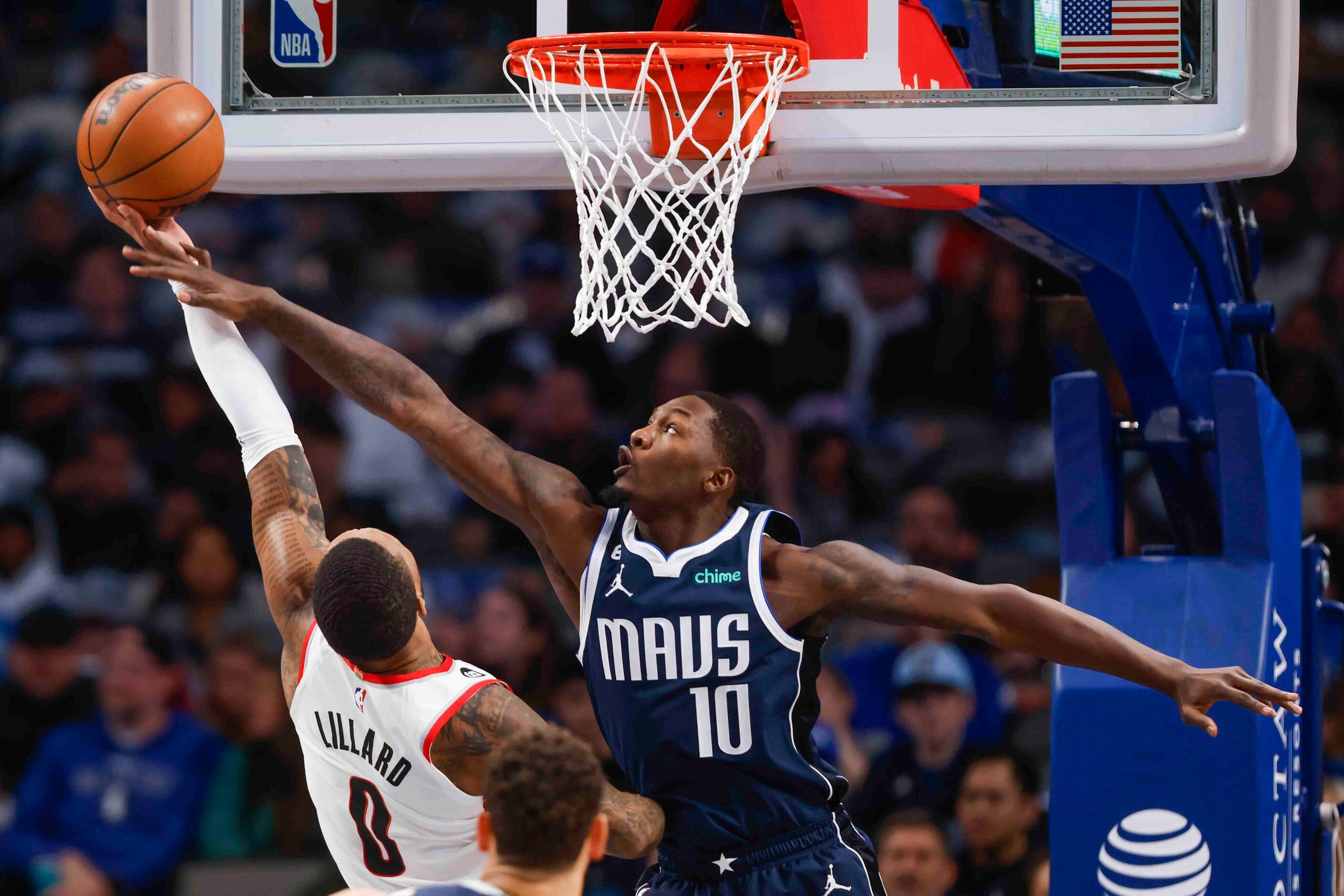 Dallas Mavericks forward Dorian Finney-Smith (10) blocks a shot of Portland Trail Blazers...