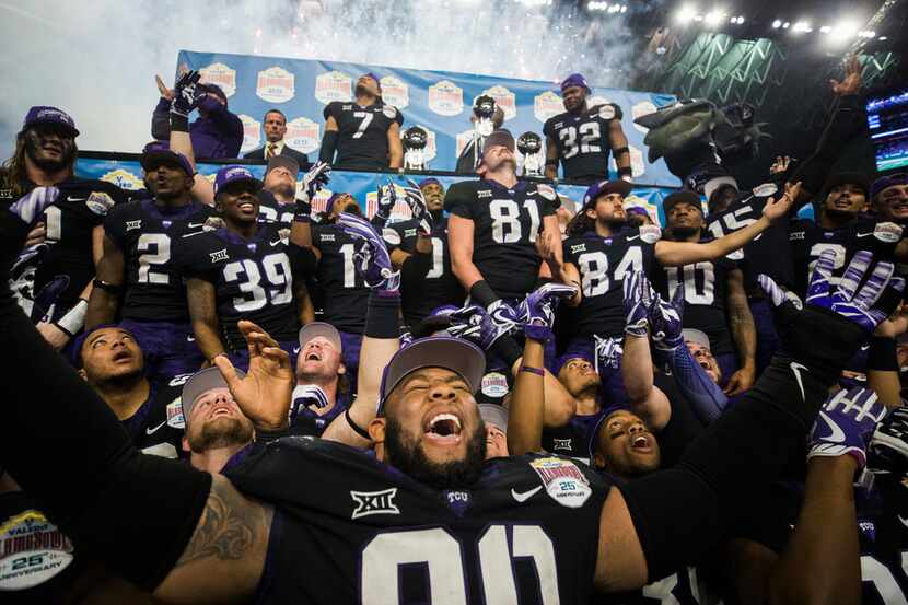 TCU Horned Frogs celebrate a 39-37 win over the Stanford Cardinals after the Valero Alamo...