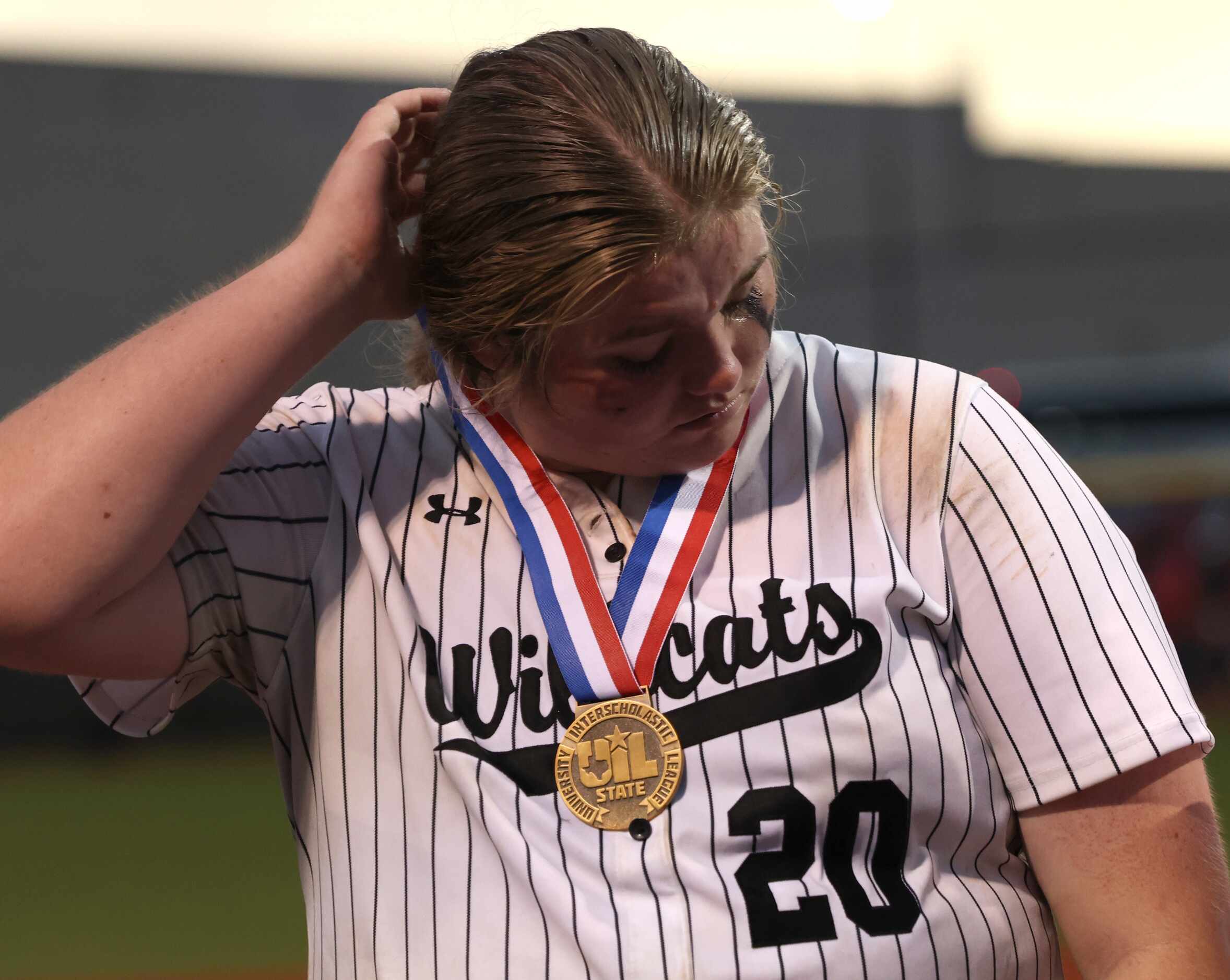 Denton Guyer pitcher Finley Montgomery (20) feels the pain after the Wildcats' season-ending...