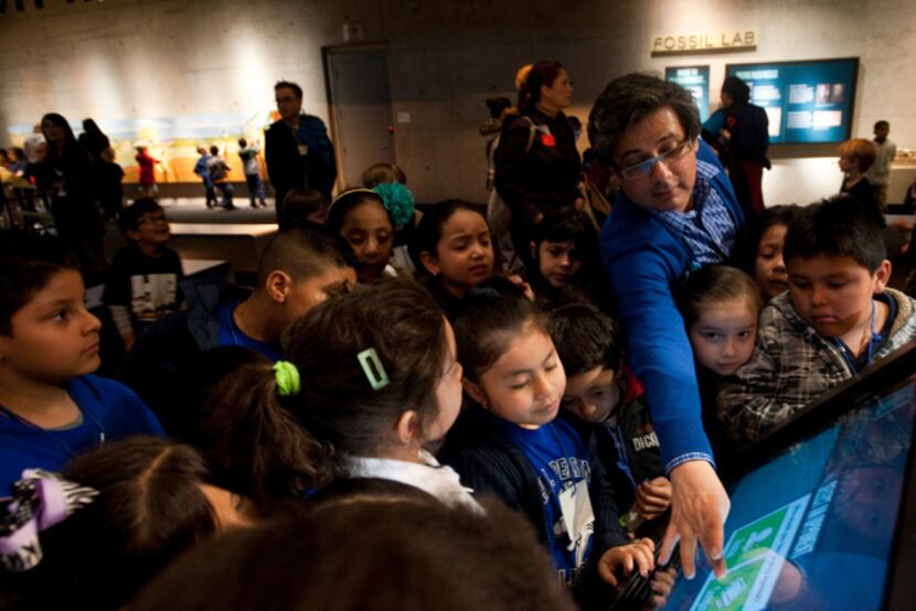 Jorge Caepena, a first-grade teacher at Pershing Elementary School, led his students through...