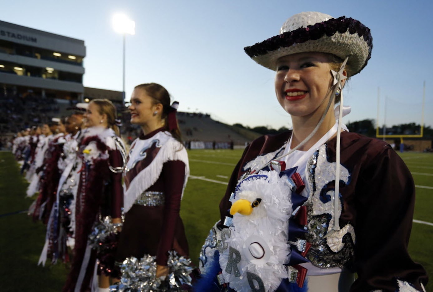 (TXHSFB) Rowlett drill team member Marlena Redmond, 15, a sophomore, sports a mum with an...