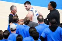 Officials step in to separate Dallas Mavericks guard Luka Doncic from Oklahoma City Thunder...