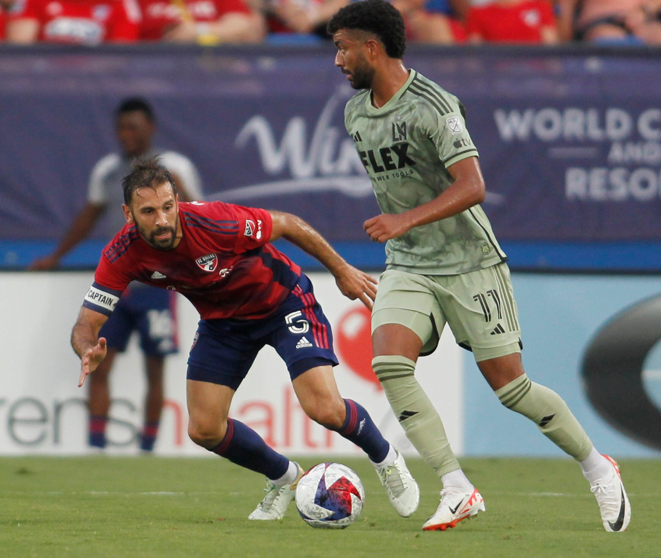 FC Dallas midfielder Facundo Quignon (5) aggressively defends LA FC midfielder Timothy...