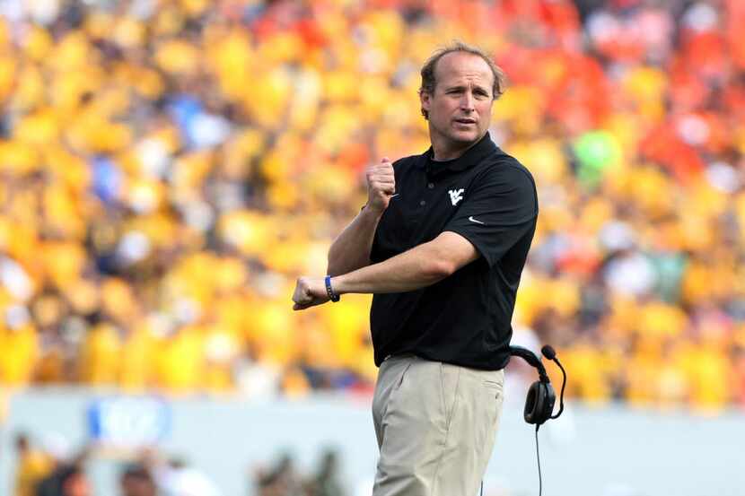 West Virginia head coach Dana Holgorsen led his team to a 30-21 win over Oklahoma State this...