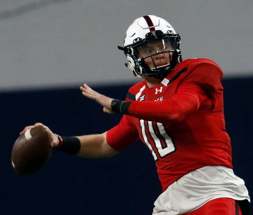 Texas Tech quarterback Alan Bowman (10) launches a long pass which resulted in a touchdown...