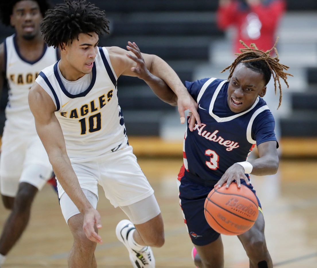 Oak Cliff Faith Family guard Isaac Williams (10) reaches in on Aubrey High School guard...