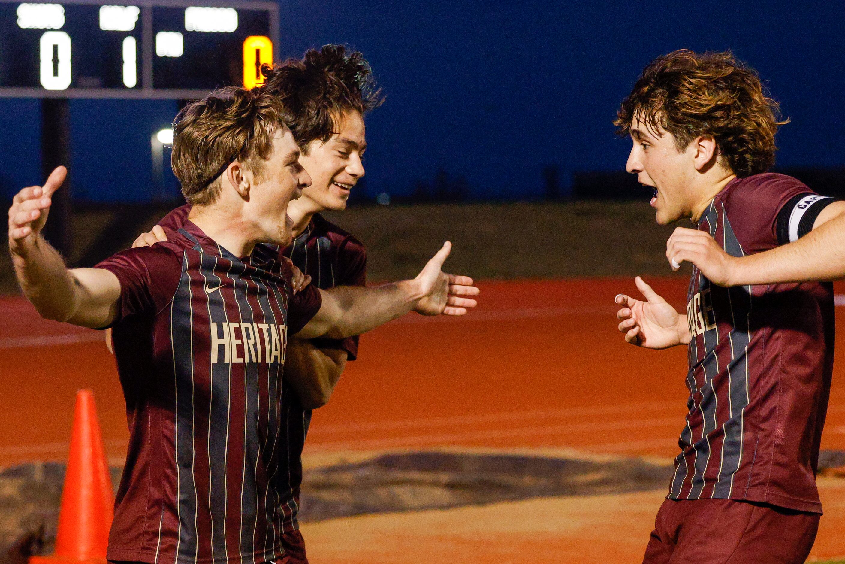 Frisco Heritage forward Jacob Culpepper (8) celebrates his goal with teammates Jorge Torres...