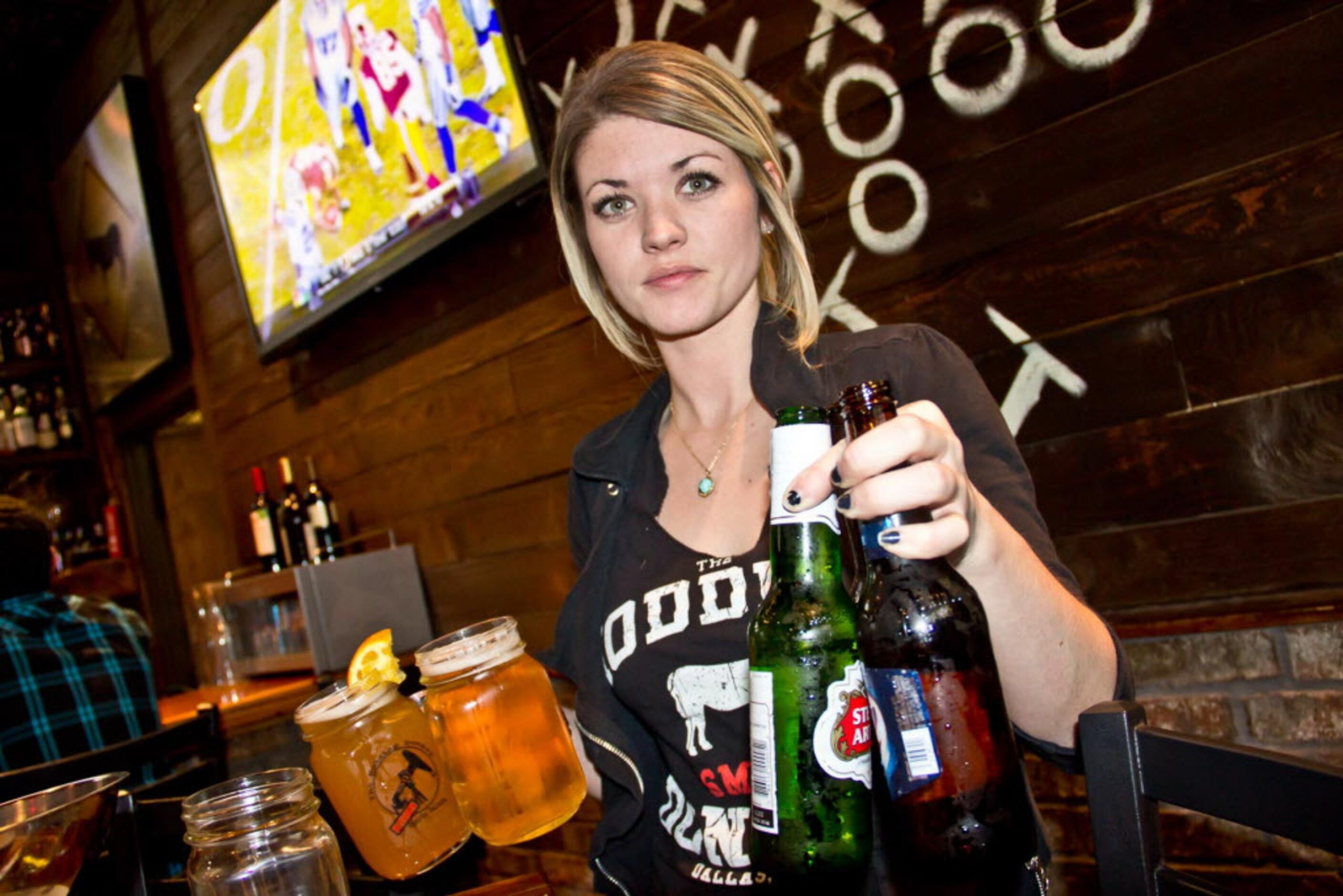 Chloe Coleman serving up drinks to Cowboy game watchers at Nodding Donkey near SMU on Dec...