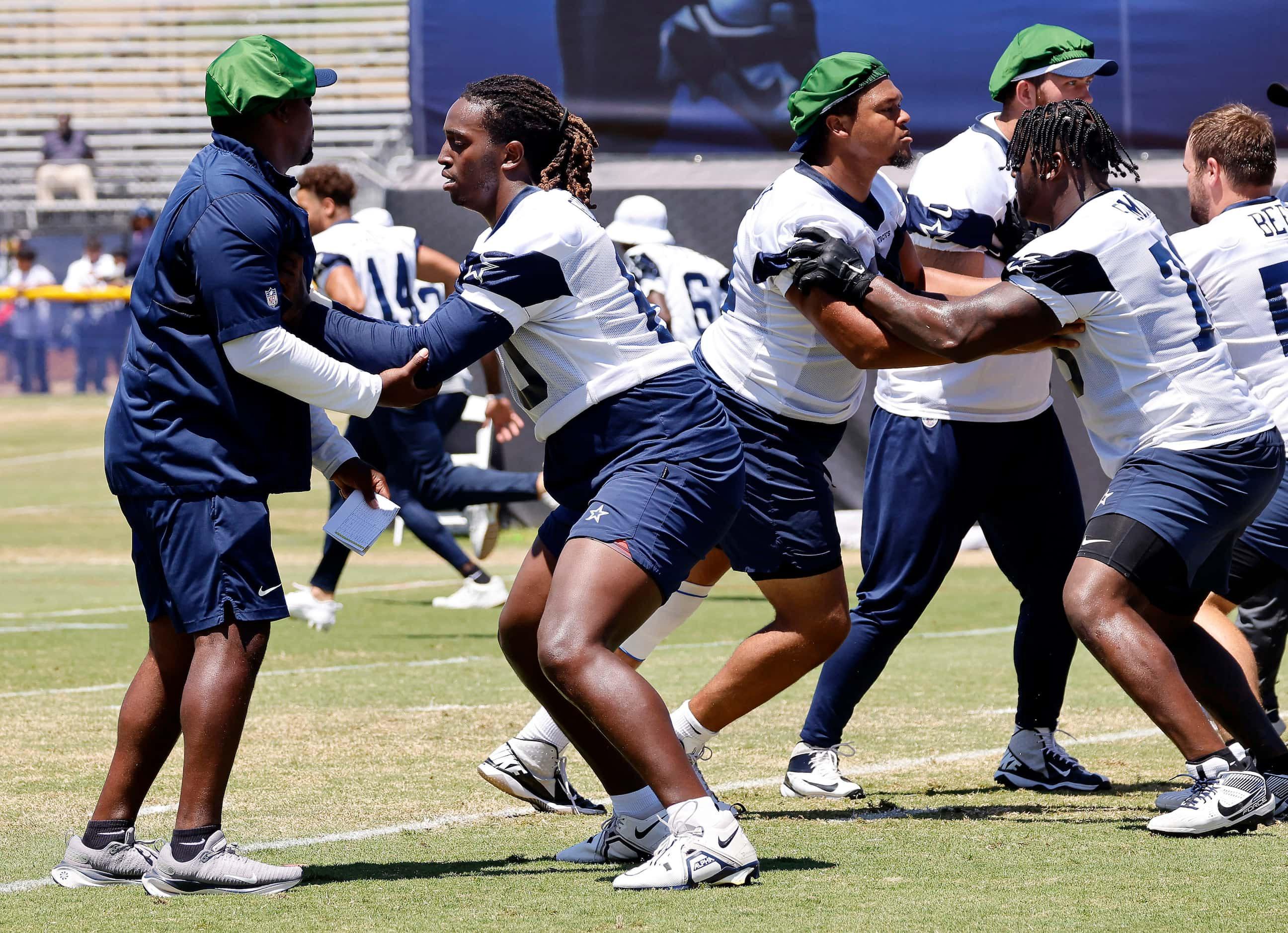 Dallas Cowboys tackle Tyler Guyton (60) sets a block during a mock game walk thru at...