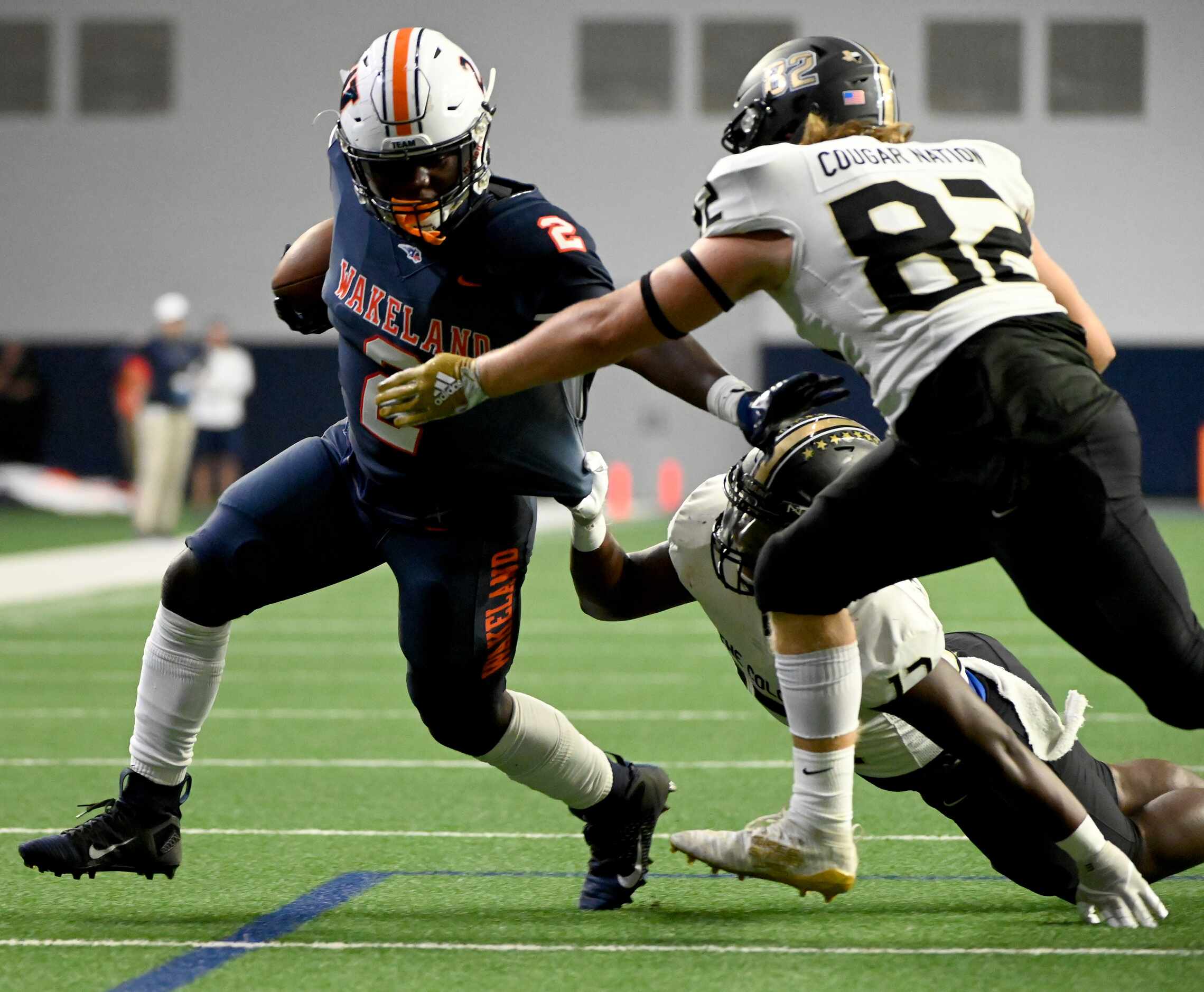 Frisco Wakeland's Jared White (2) runs through tackle attempts by The Colony's Devin Hensley...