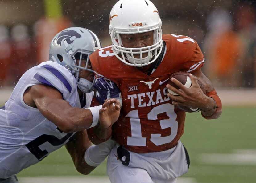 Texas quarterback Jerrod Heard (13) runs the ball against Kansas State's Kendall Adams...