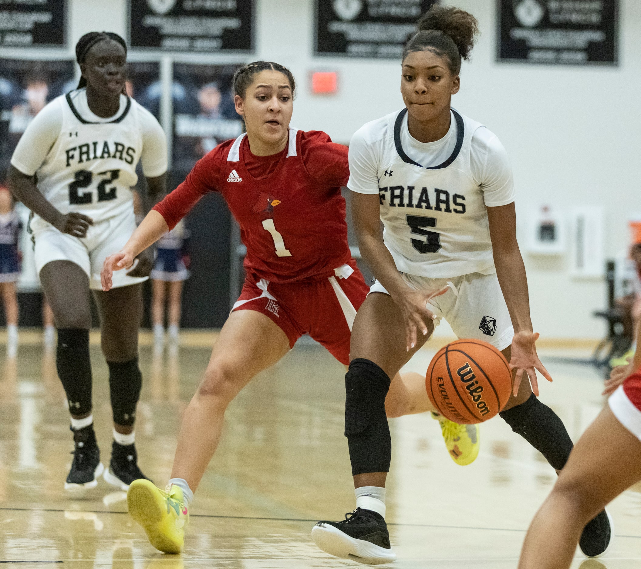 Bishop Lynch High School Maddie Cockrell (5) dribbles the ball towards toward the basket...