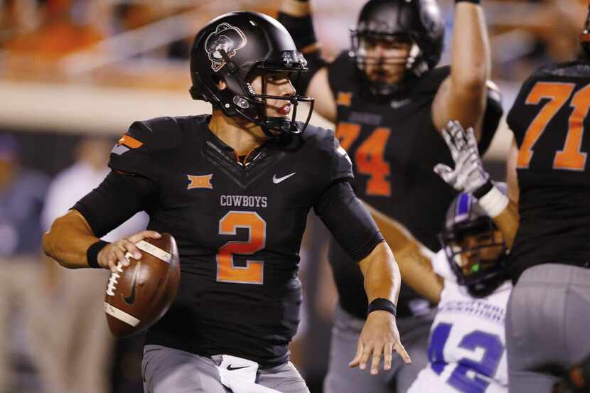 Oklahoma State quarterback Mason Rudolph passes in the third quarter of an NCAA college...