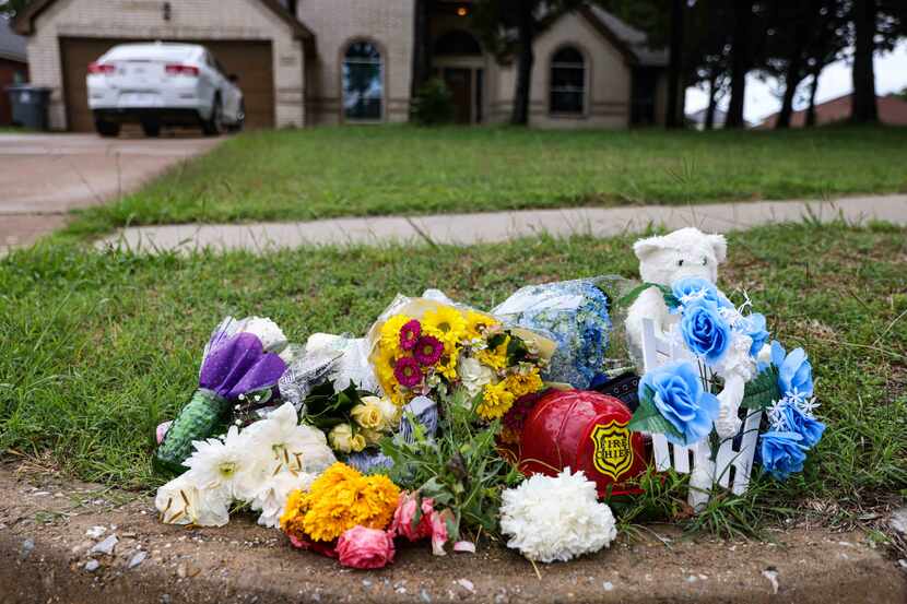 A makeshift memorial on Saddleridge Drive in Dallas on Monday, May 17, 2021, rests on the...
