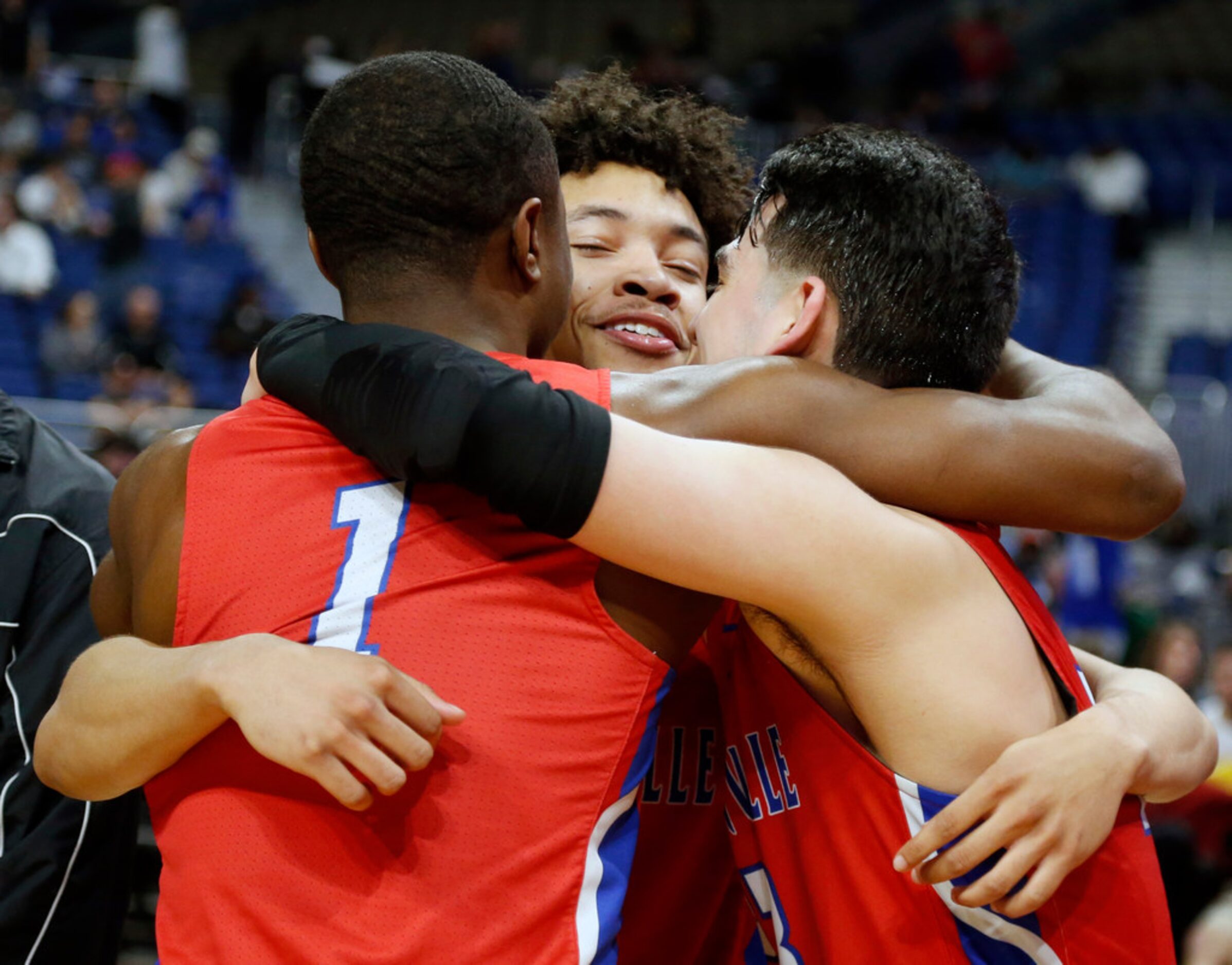 Duncanville's Miles Bennett #12, center, Duncanville's Keyaun Hoskin #1, and Duncanville's...