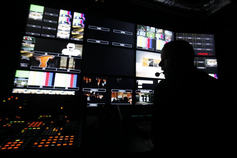 Technical crews perform a live production from their video control room as the staff holds a...