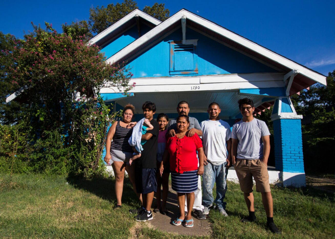 The Palma family posed for a photo outside their home on Monday on Pine Street in Dallas....