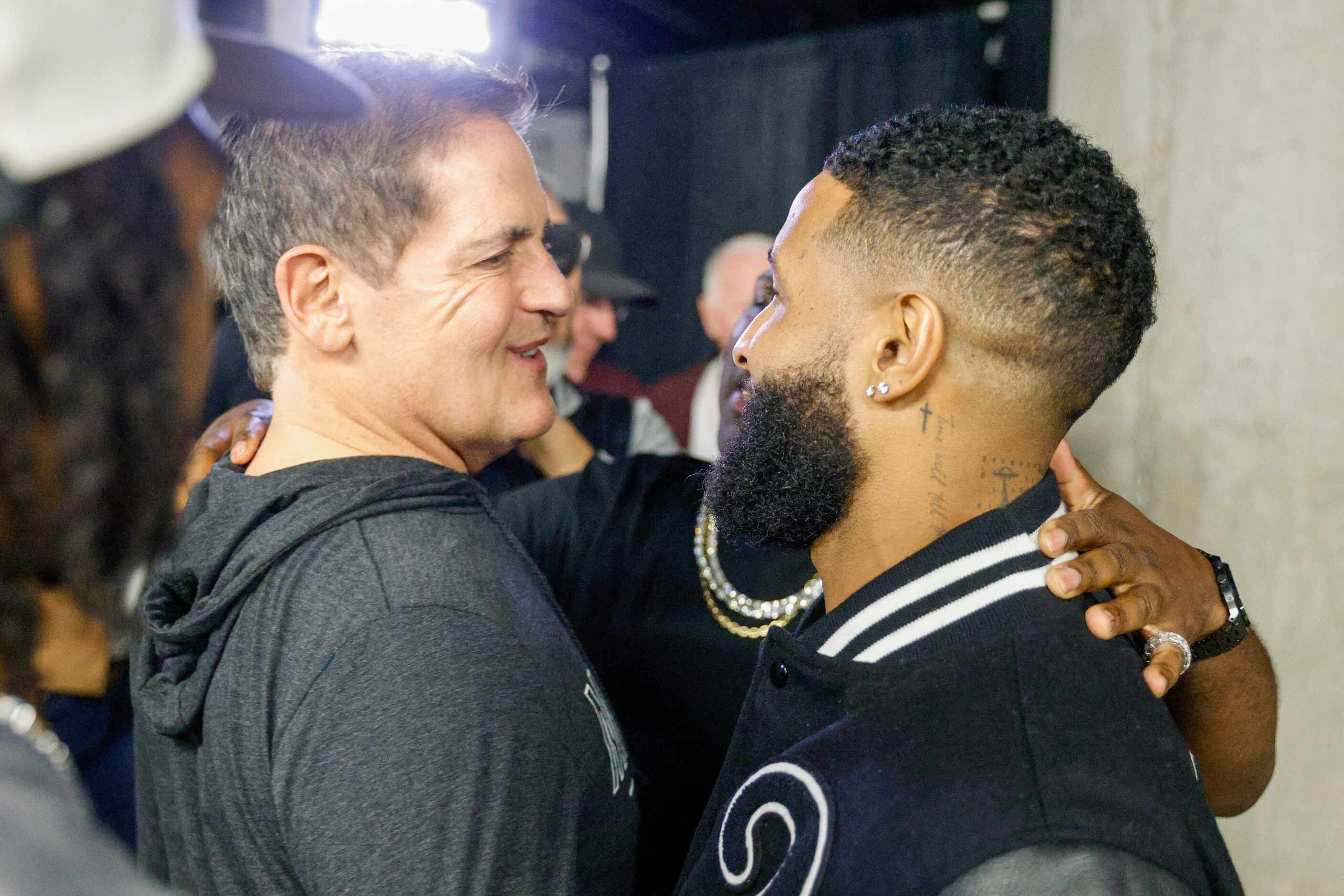 NFL free agent Odell Beckham Jr. (right) greets Dallas Mavericks owner Mark Cuban after an...