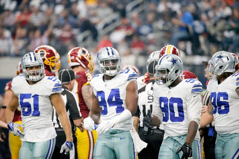 Dallas Cowboys defensive end Randy Gregory (94) talks with teammates after a play during the...