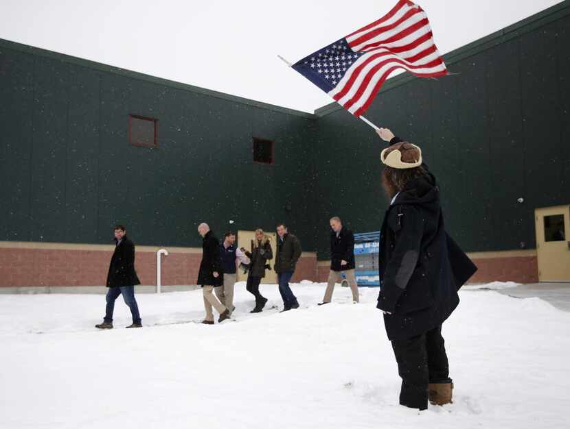 
Rod Webber of Boston waved an American flag in support of Ted Cruz as the candidate left a...
