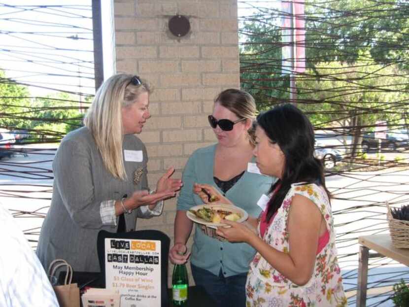 Krista Hartman, left, a founding member of Live Local East Dallas, signs up new members at...