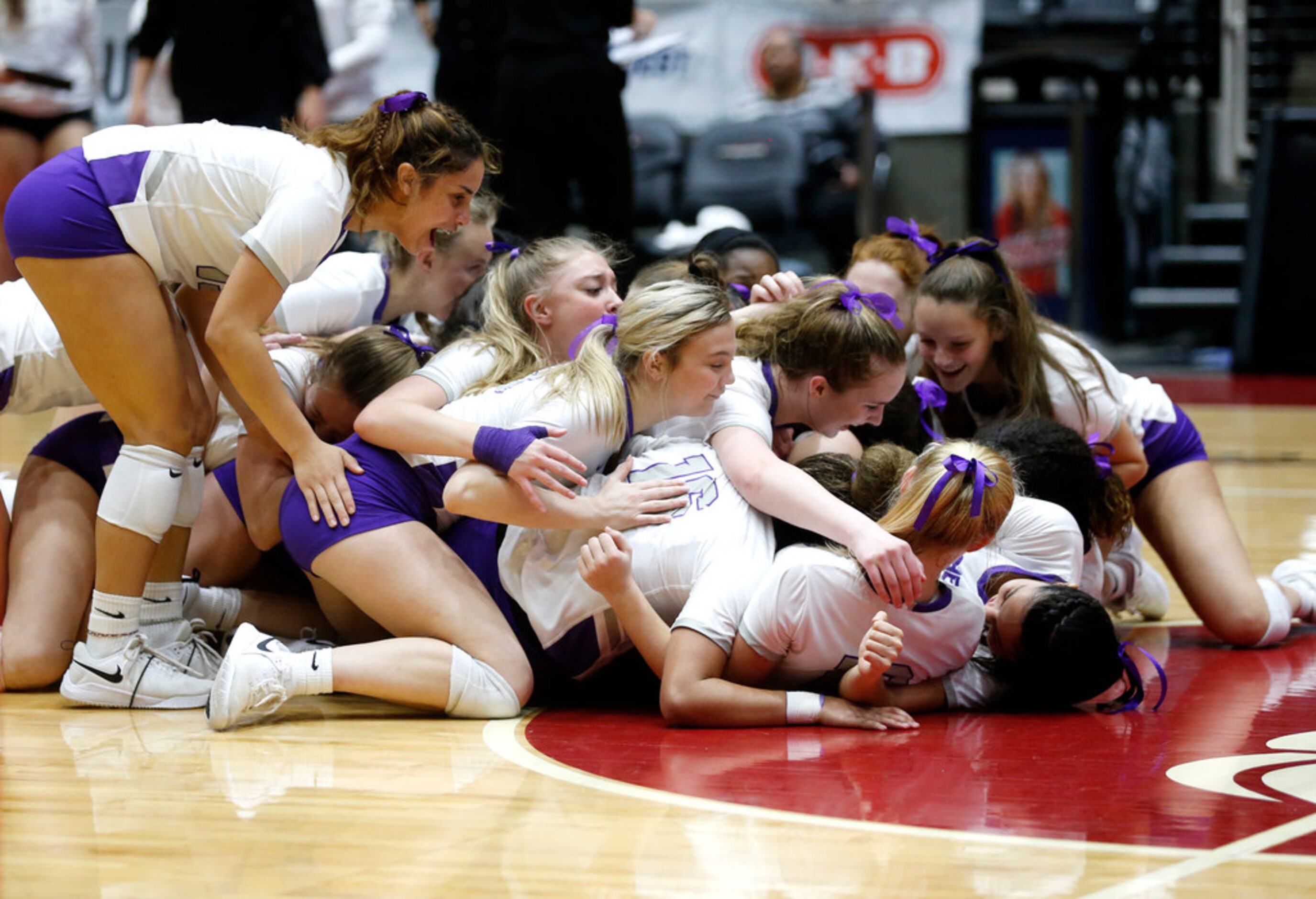 Kennedale Angel Mahjoub (8) sheds tears during a team huddle after a Class 4A volleyball...