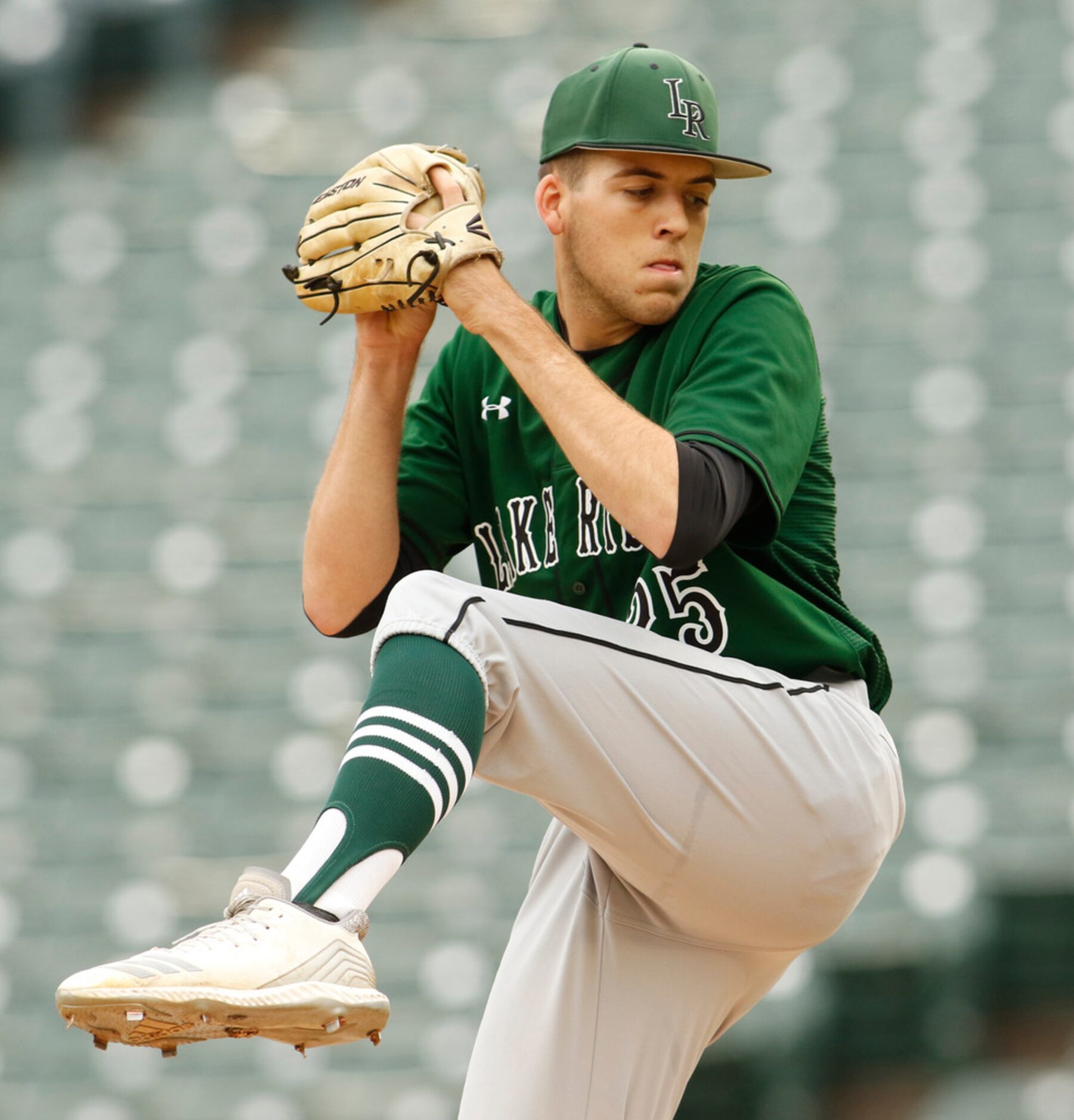 Mansfield Lake Ridge pitcher Noah Pelletier (25) delivers a pitch during first inning action...