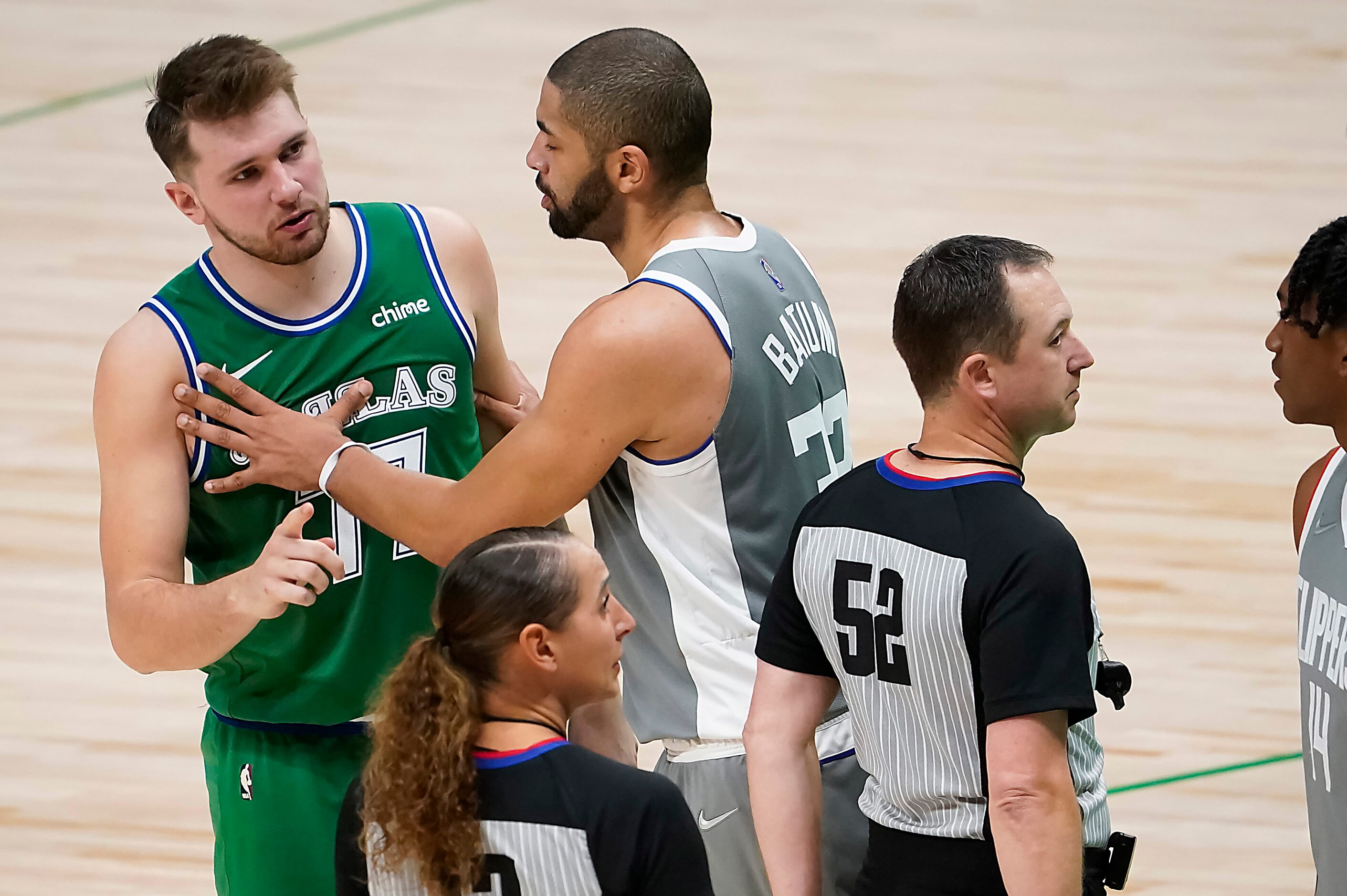 LA Clippers forward Nicolas Batum (33) steps in to separate Dallas Mavericks guard Luka...