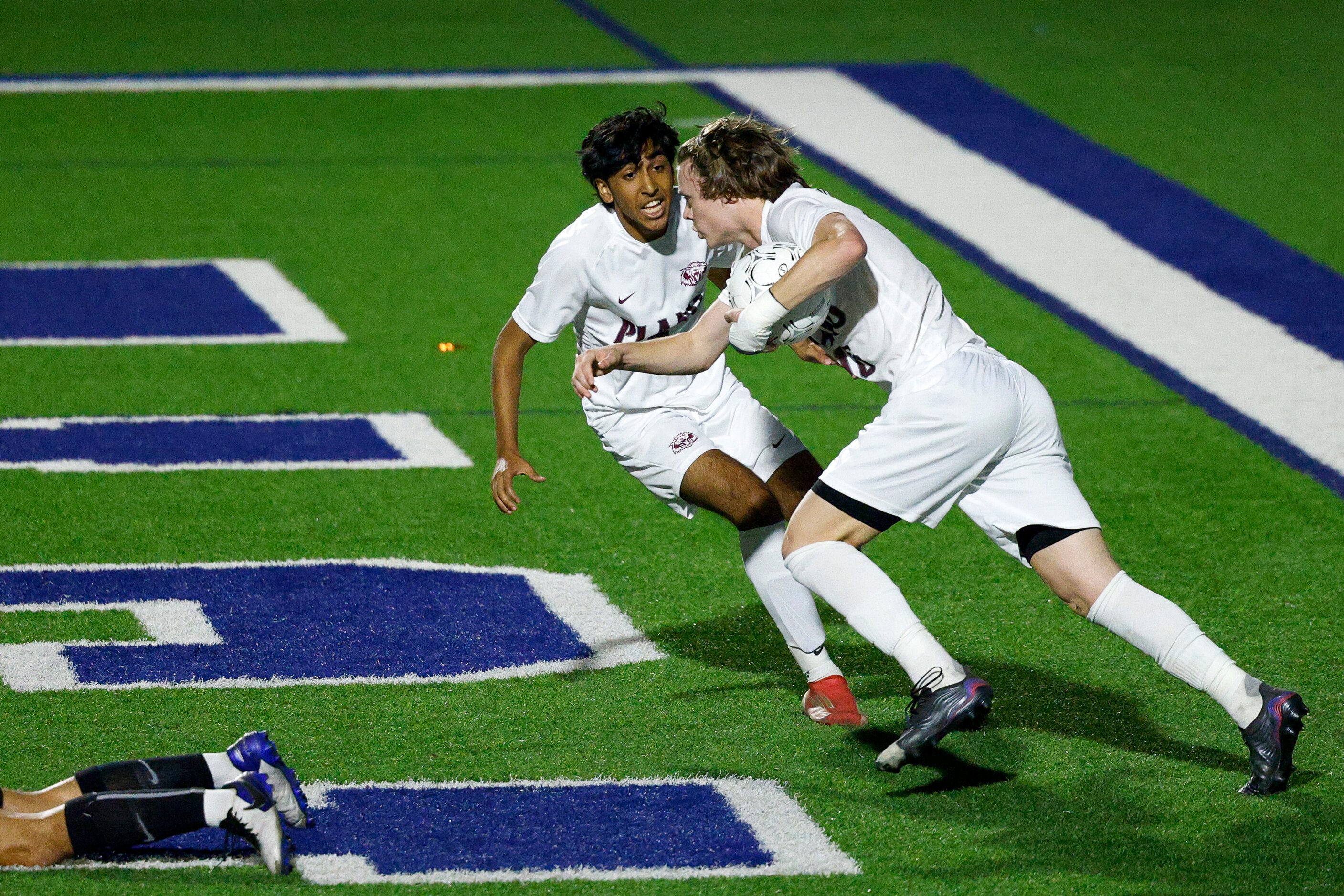 Plano forward Nolan Giles (16) runs with the ball alongside Plano midfielder Sami Qazi (7)...