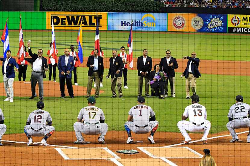 First pitch ceremony by a group of Hall of Fame Hispanic and current players before the...