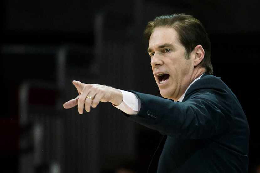 SMU head coach Tim Jankovich directs his team during an NCAA basketball game against Tulane...
