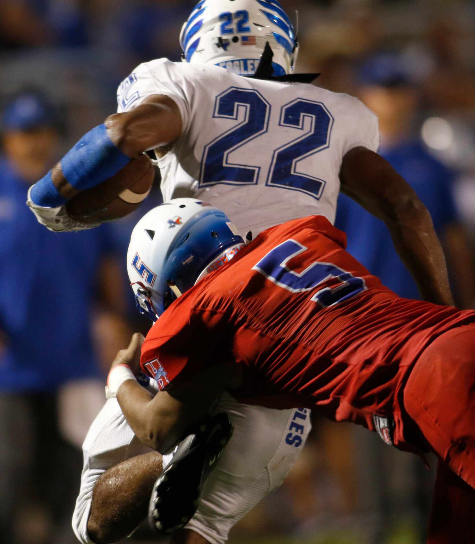 Midlothian Heritage defensive end Damian Alexander (5) dives to stop the progress of Lindale...