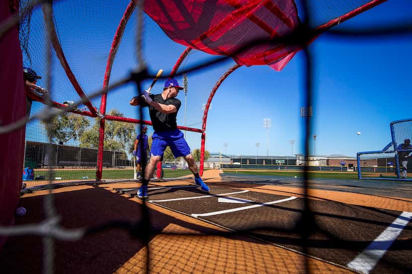 Texas Rangers infielder Nick Solak takes batting practice during a spring training workout...