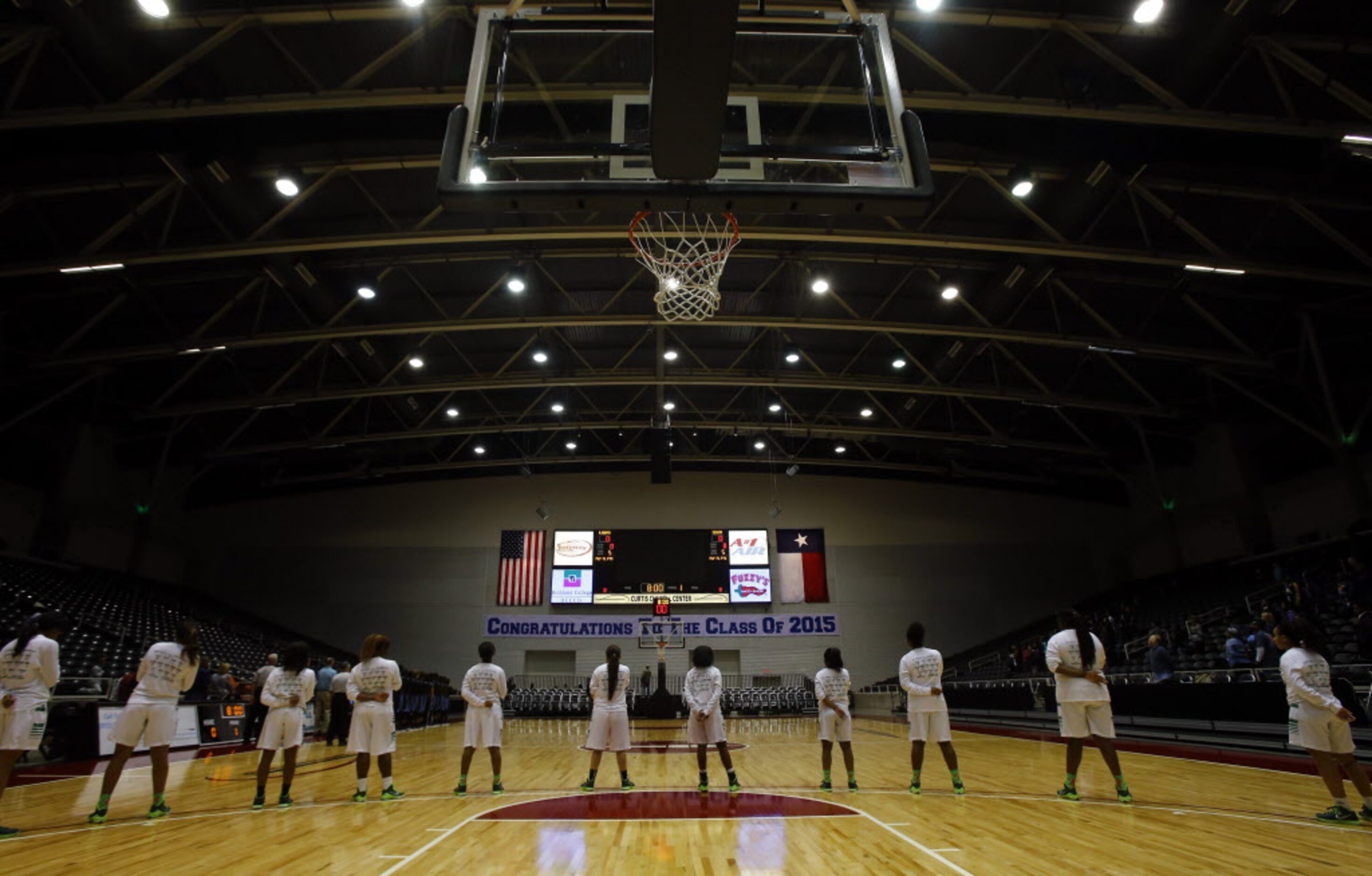 Bryan Adams lines up for the national anthem before the Class 5A Region II girls basketball...