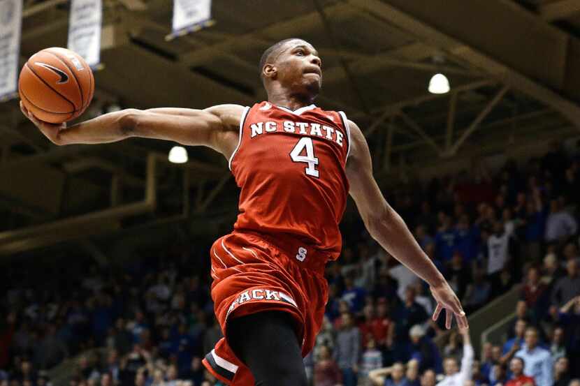 FILE - In this Jan. 23, 2017 file photo, North Carolina State's Dennis Smith Jr. (4) drives...