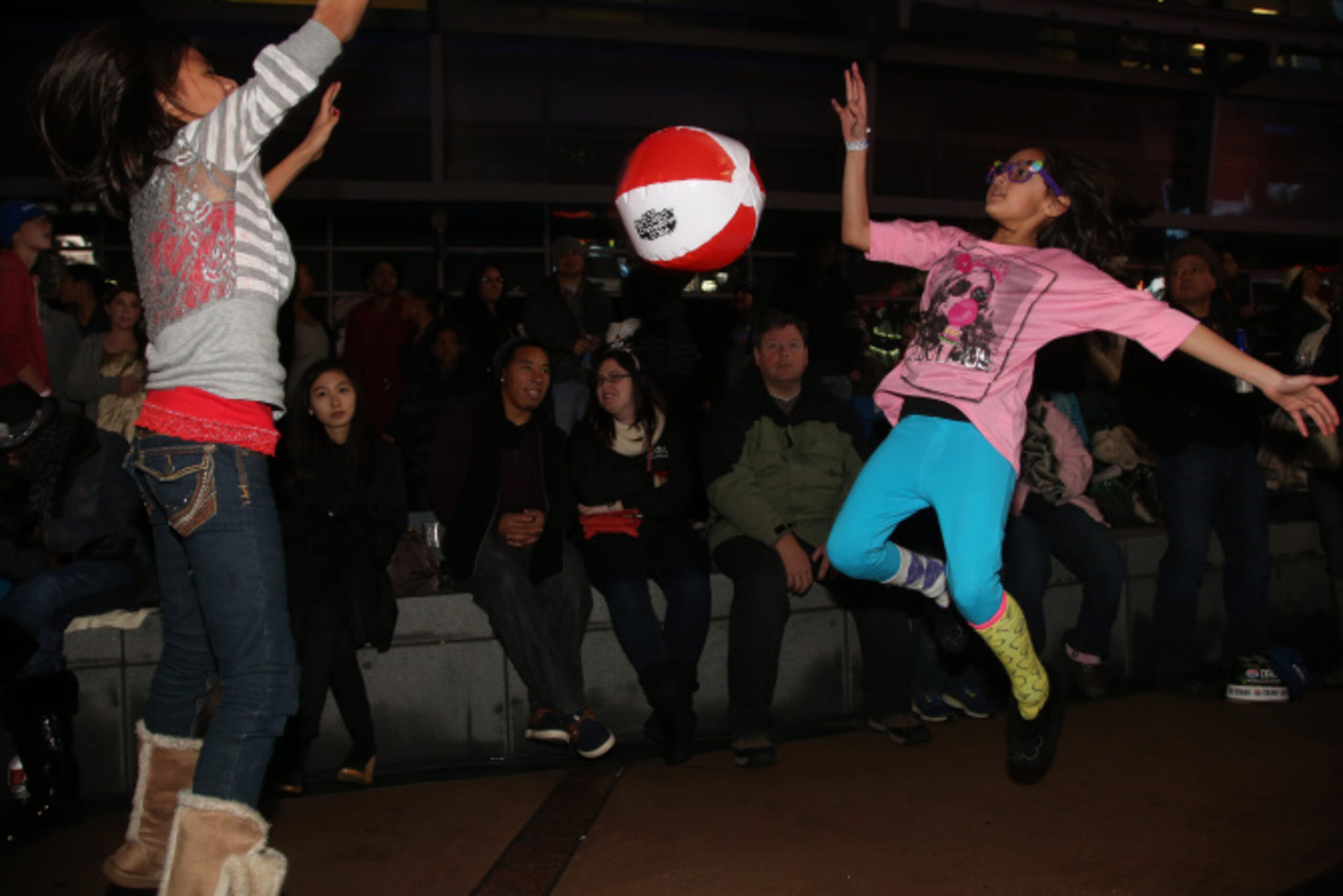 Lauren Campos, 9, and Brianna Salazar, 9 play during Big D New Years Eve celebration at...