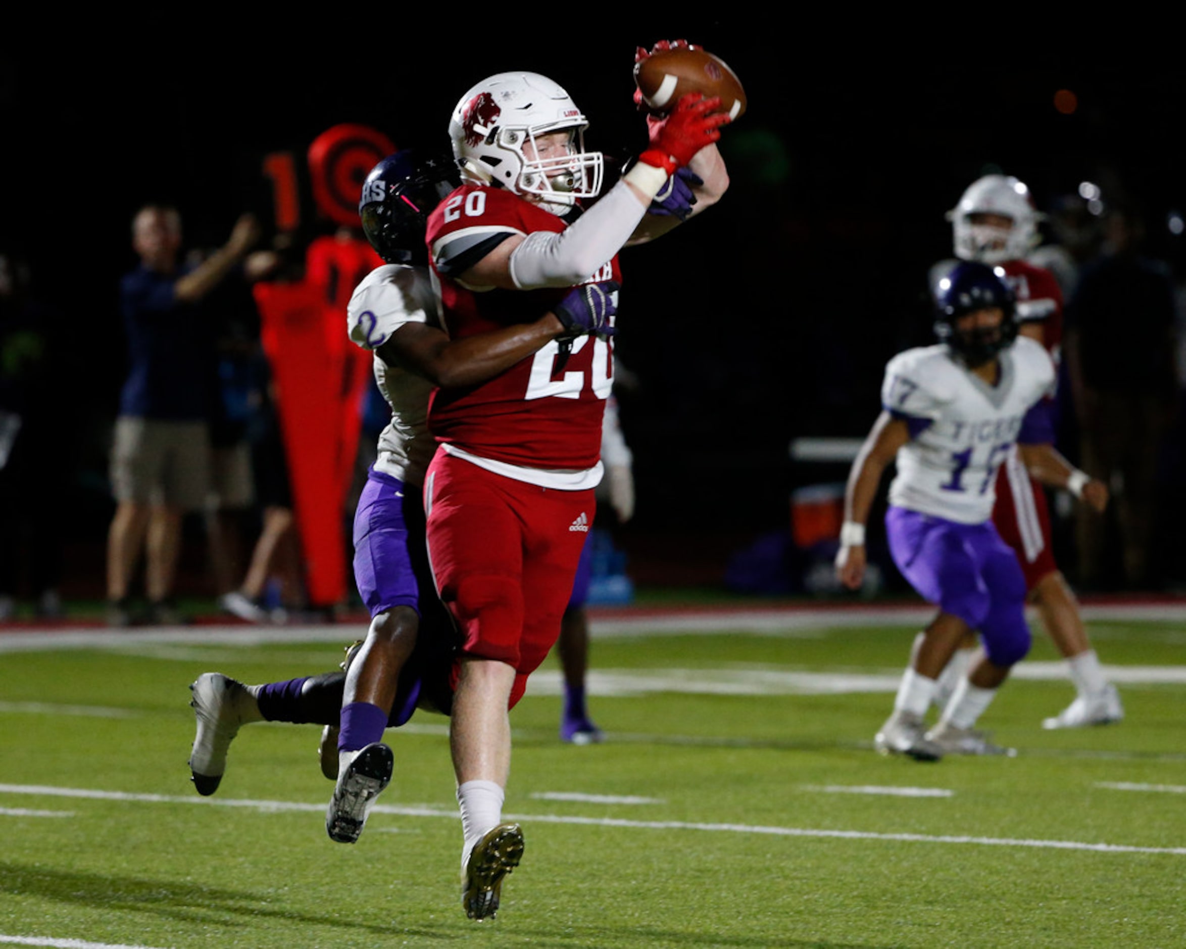 Grapevine Faith Chritian's Hilton Harris catches a pass that he converted to a touchdown...